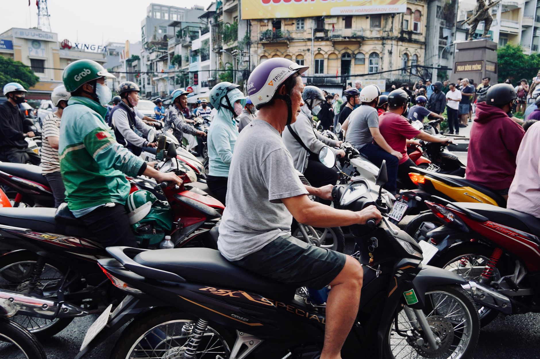 ho chi minh city street scooters traffic